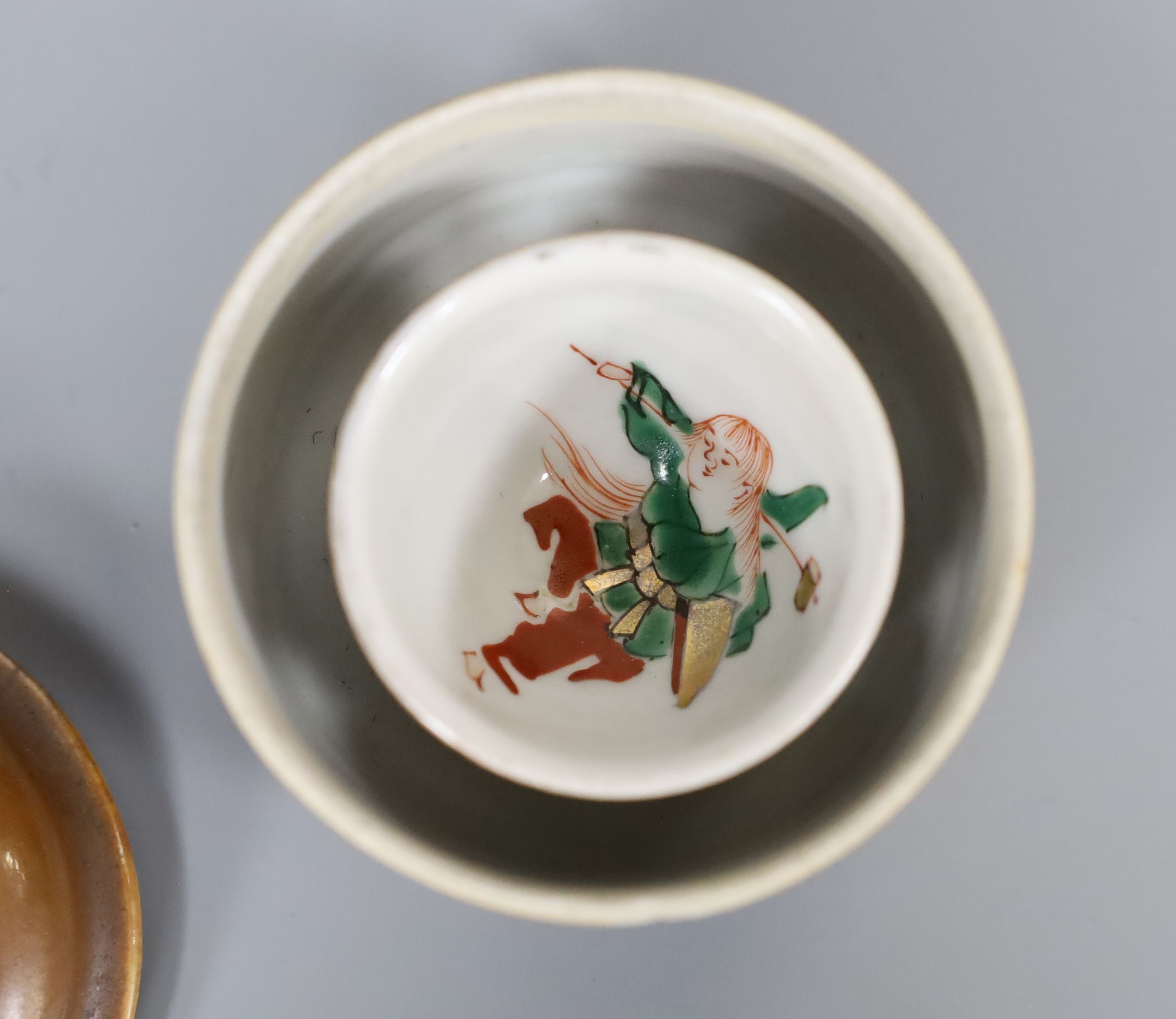 A Chinese cafe au lait glazed saucer, three bowls and a stem cup